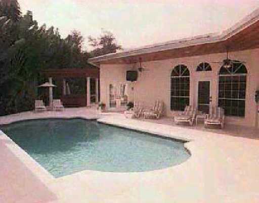 860 Bailey Street Boca Raton, FL 33487 - Photo 2 of 2 a view of a house with swimming pool