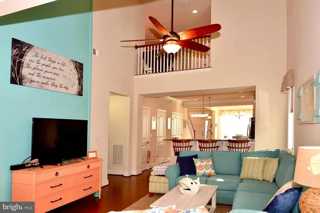 a view of a livingroom with furniture and a flat screen tv