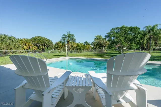 a view of a chairs and table in the patio