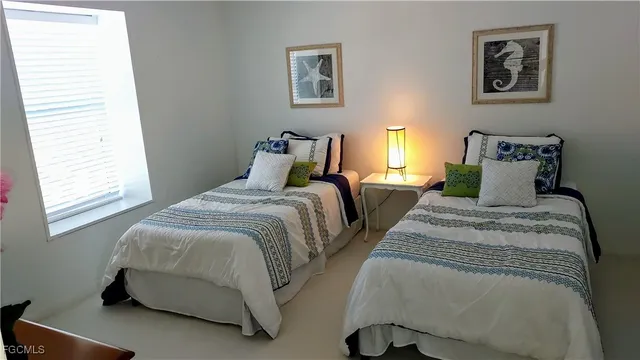 a bedroom with bed and a window