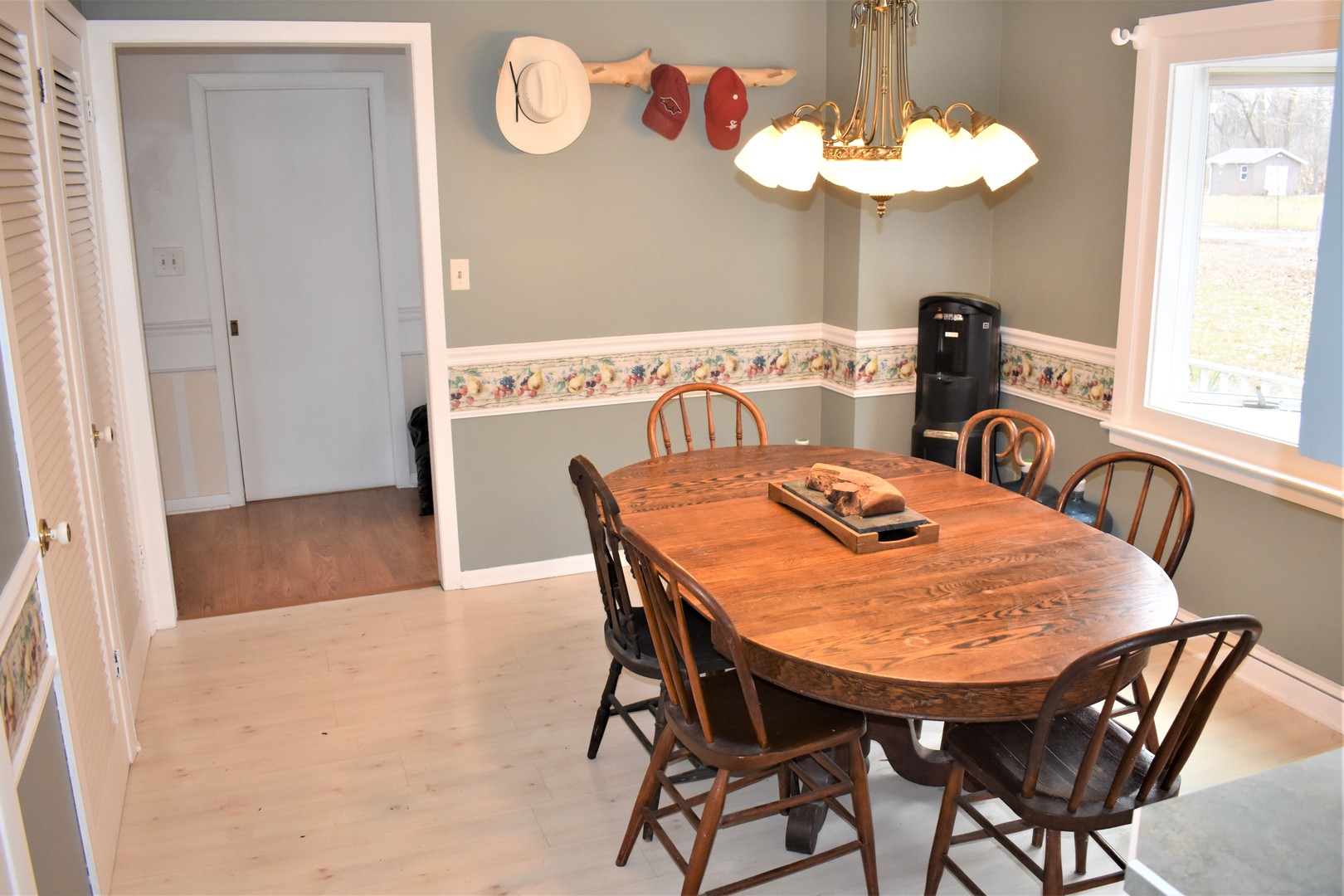 2821 A East 3500s Road Kankakee, IL 60901 - Photo 6 of 38 a view of a dining room with furniture and a chandelier