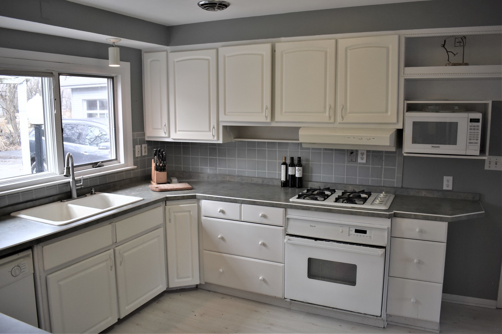 2821 A East 3500s Road Kankakee, IL 60901 - Photo 7 of 38 a kitchen with cabinets appliances a sink and a window