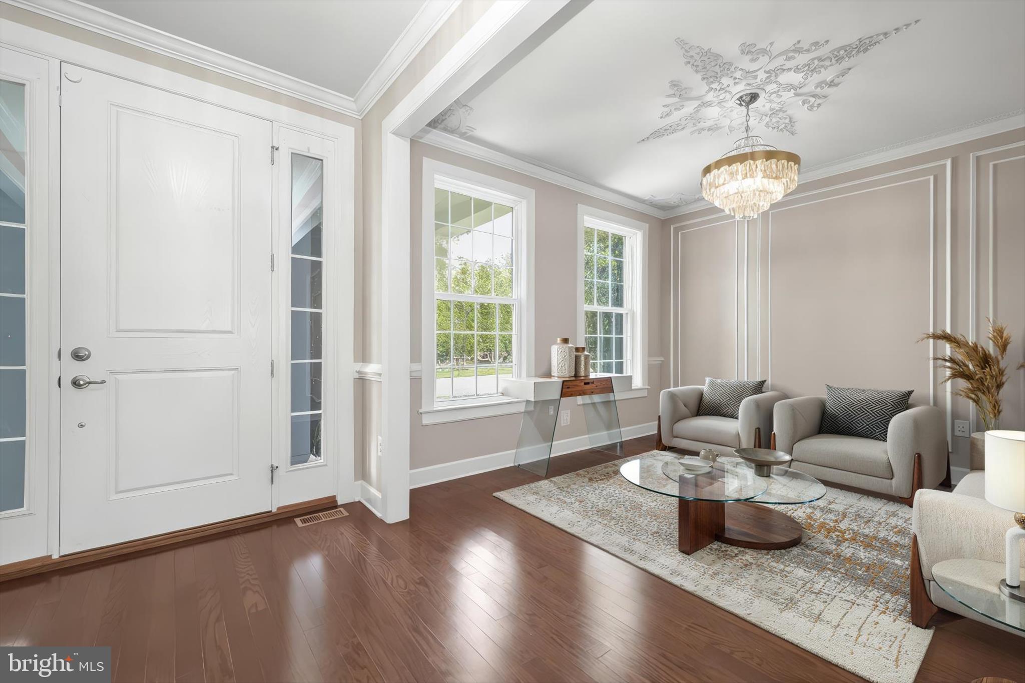 11047 Martha Way Fulton, MD 20759 - Photo 11 of 80 a living room with furniture and a chandelier