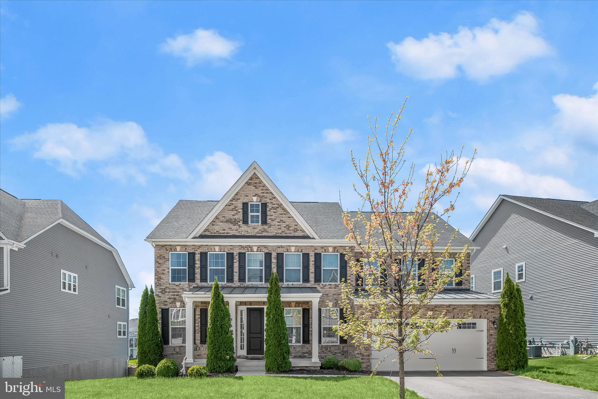 11047 Martha Way Fulton, MD 20759 - Photo 2 of 87 a front view of a house with a garden