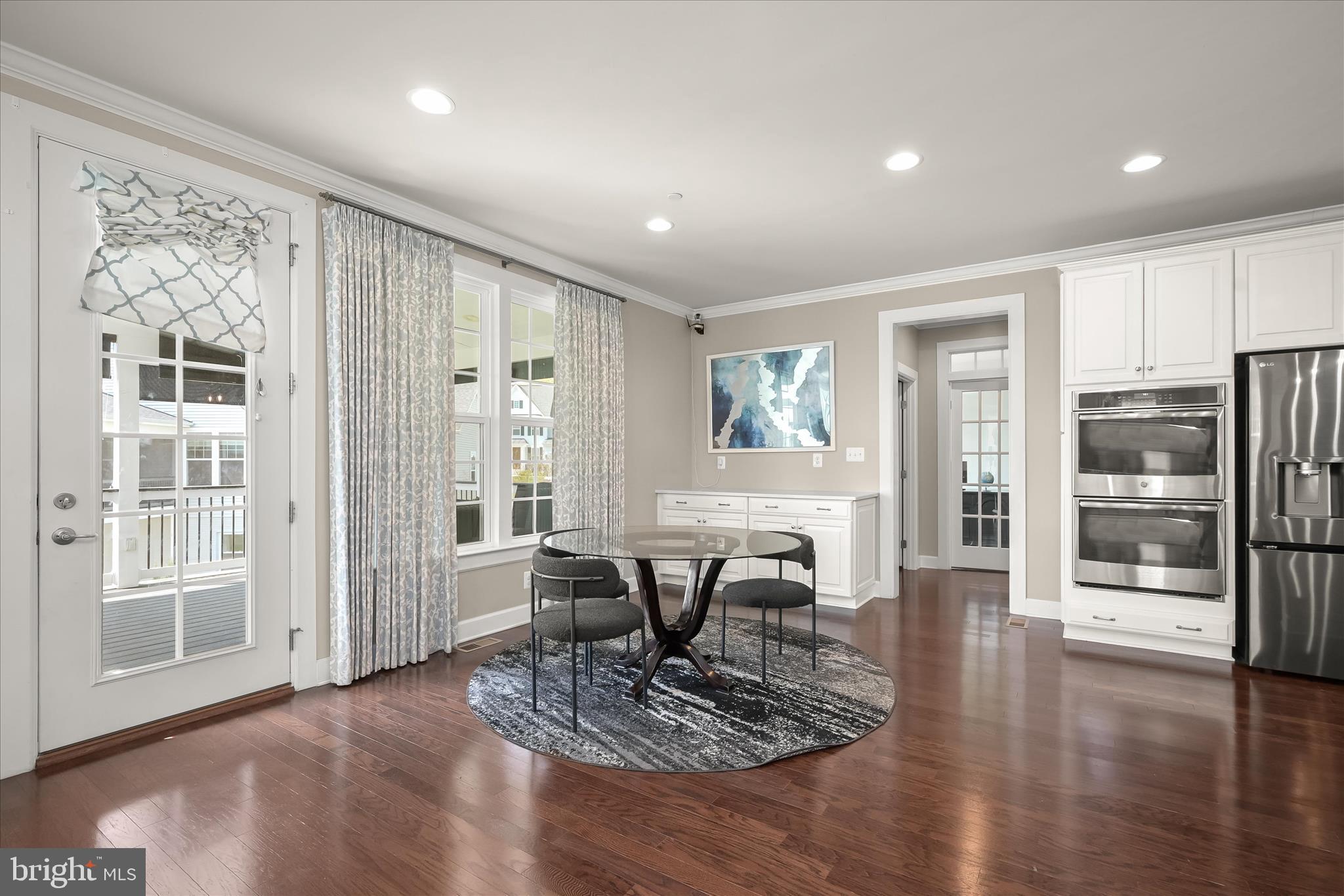 11047 Martha Way Fulton, MD 20759 - Photo 22 of 87 a view of a dining room with furniture window and wooden floor