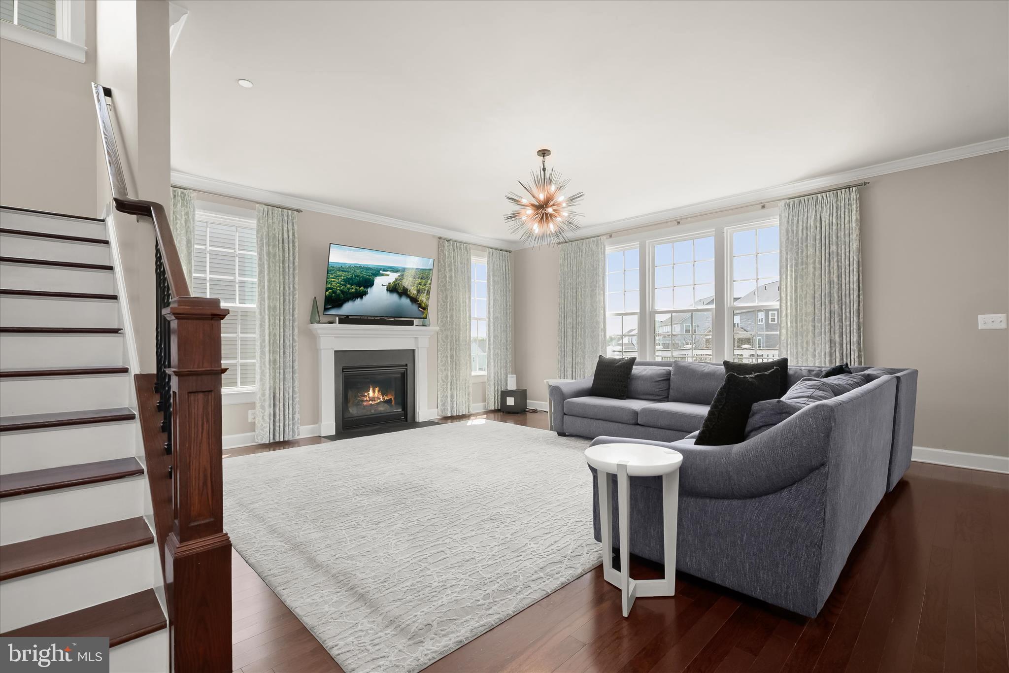 11047 Martha Way Fulton, MD 20759 - Photo 23 of 80 a living room with furniture and a fireplace