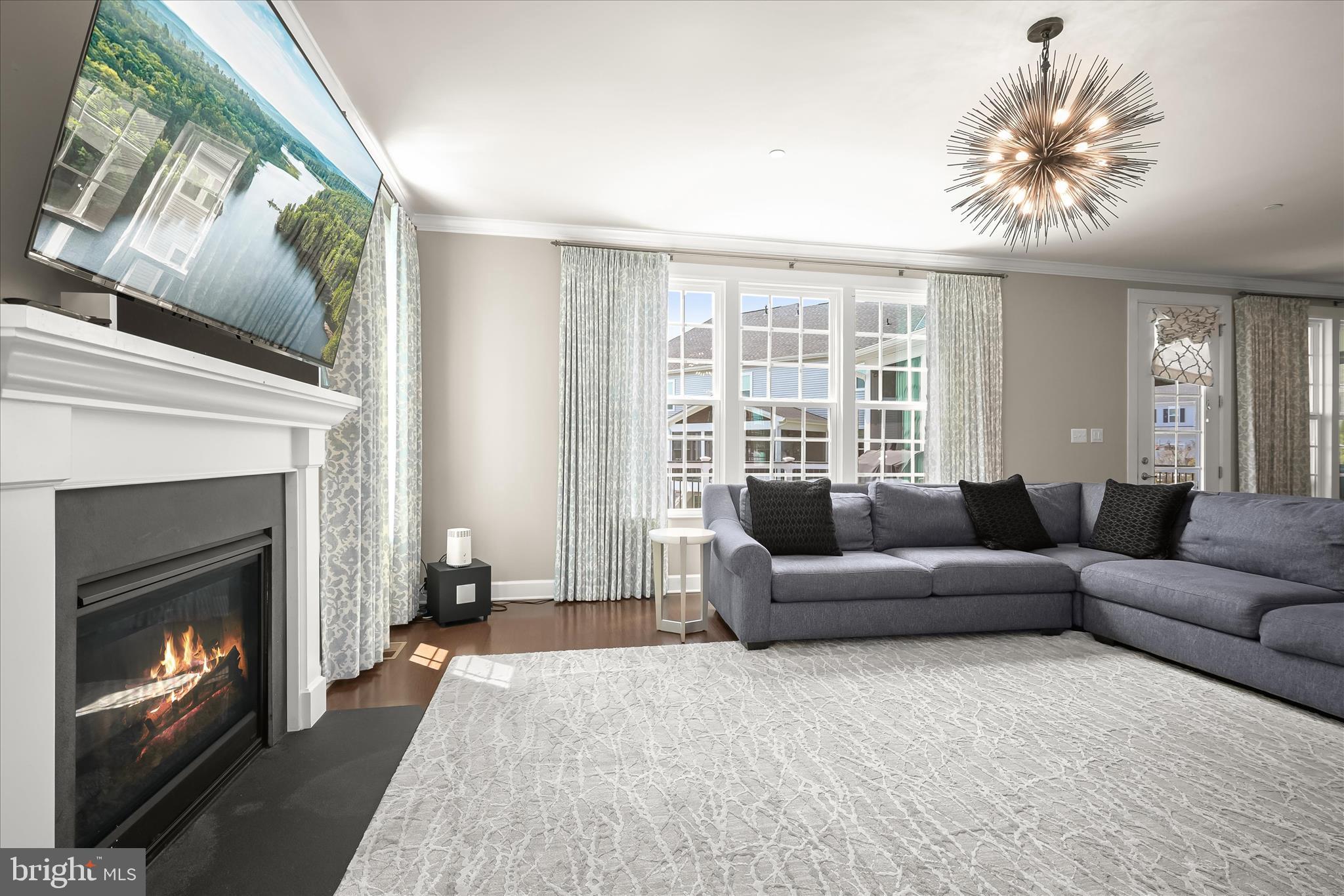 11047 Martha Way Fulton, MD 20759 - Photo 26 of 87 a living room with furniture a fireplace and a large window