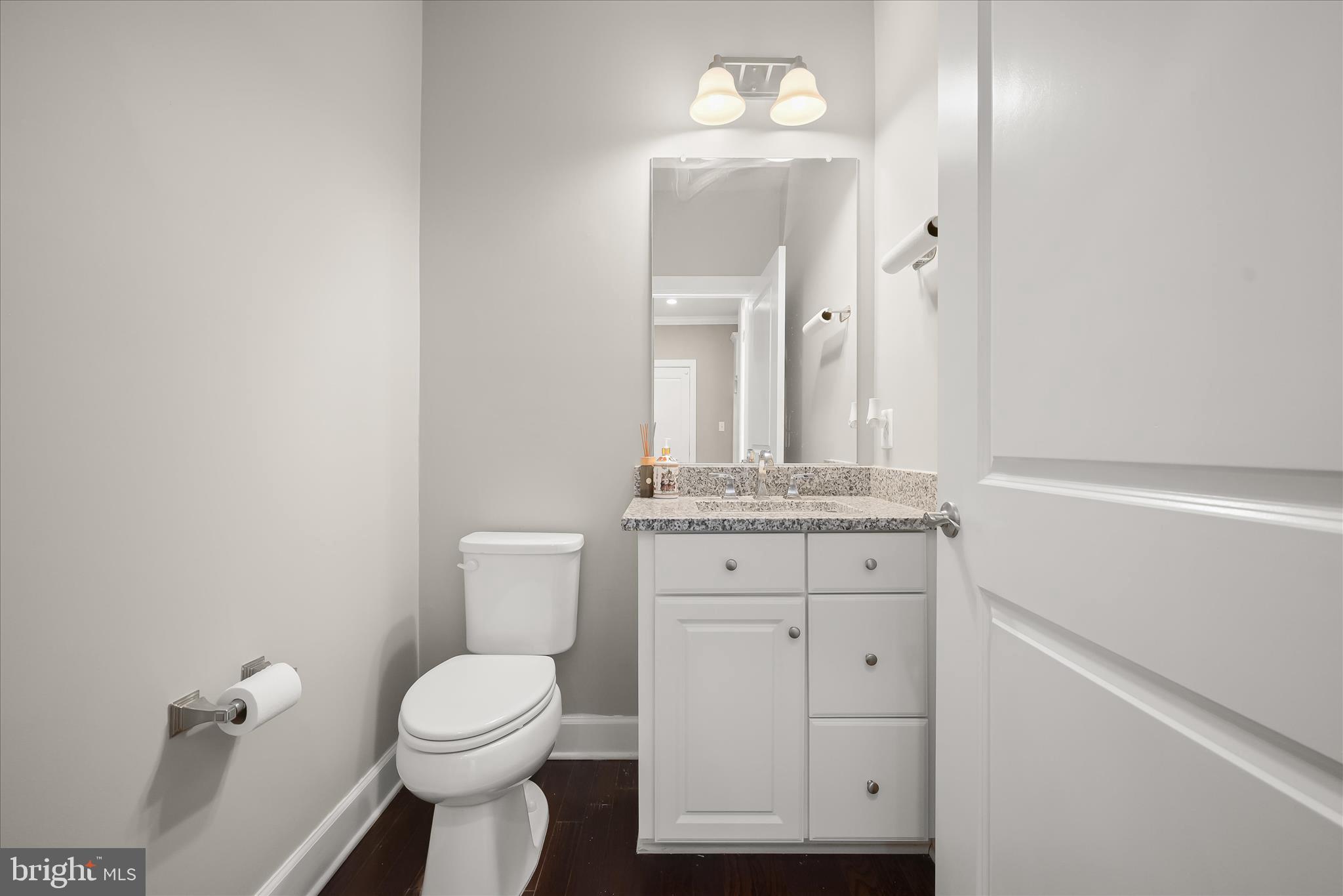11047 Martha Way Fulton, MD 20759 - Photo 27 of 80 a bathroom with a toilet sink and mirror