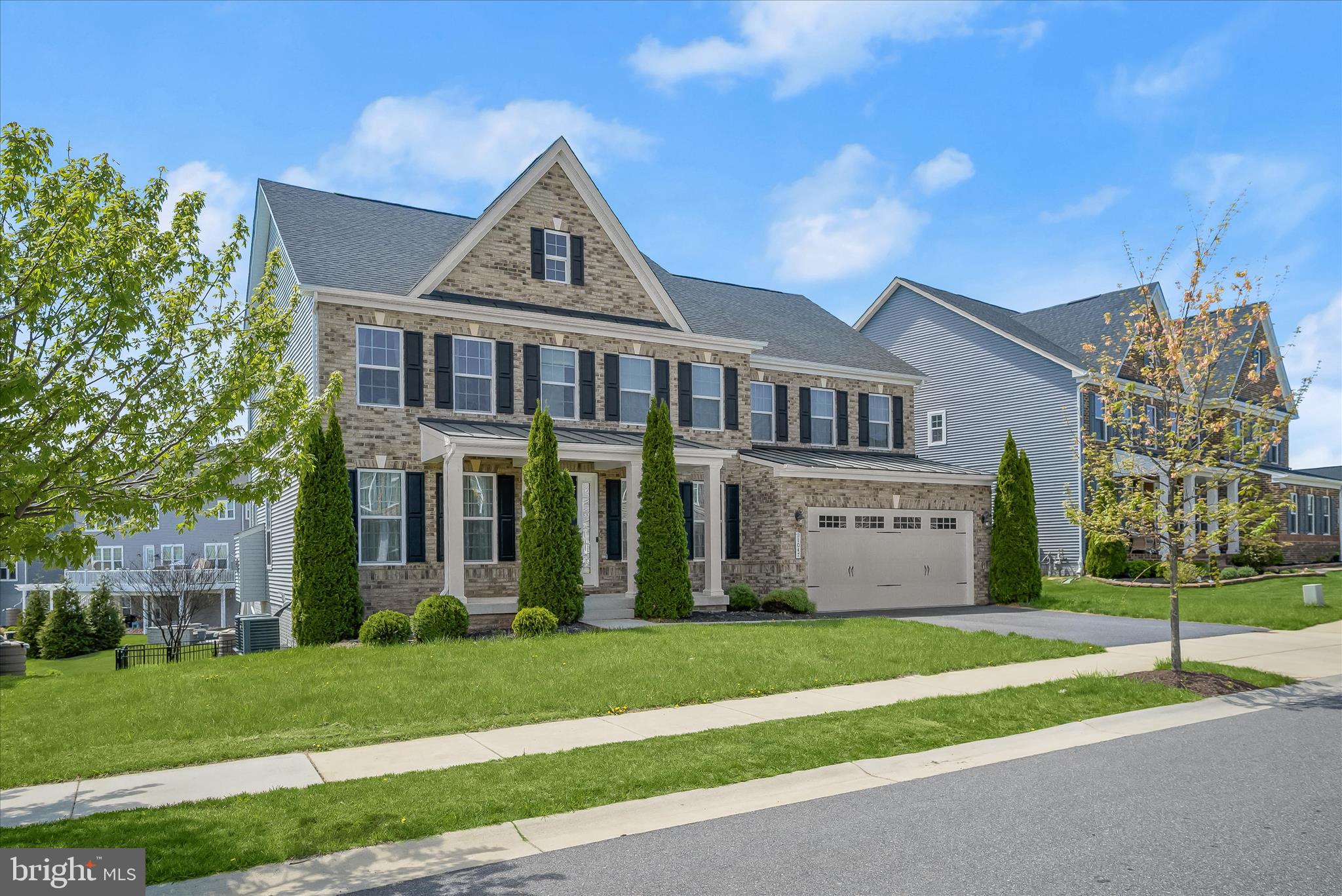 11047 Martha Way Fulton, MD 20759 - Photo 3 of 87 a view of a white house with a yard and plants