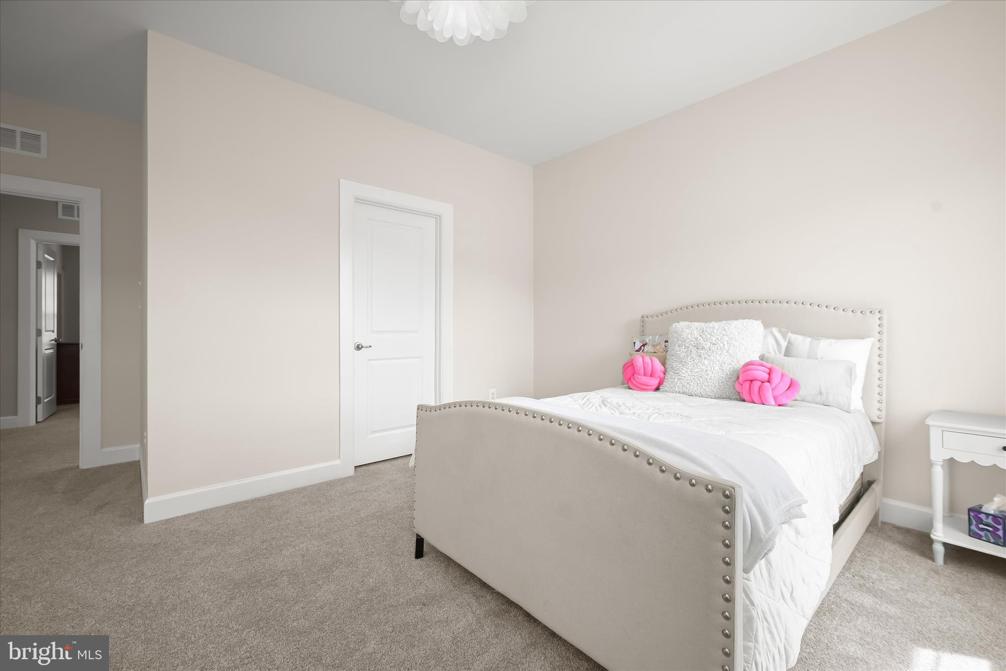 11047 Martha Way Fulton, MD 20759 - Photo 39 of 80 a bedroom with a white bed and a white cabinet