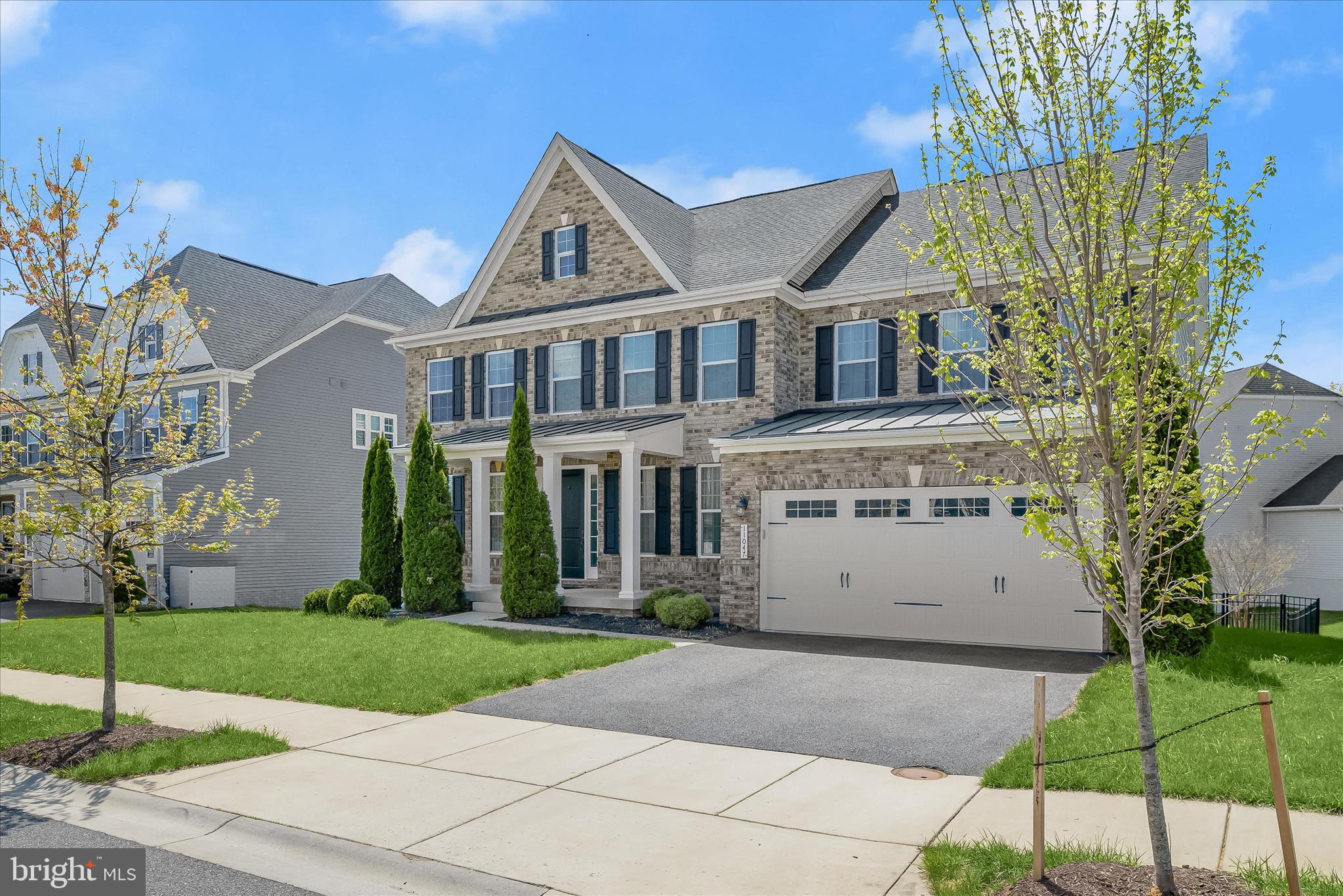 11047 Martha Way Fulton, MD 20759 - Photo 4 of 87 a view of a white house with a yard and plants