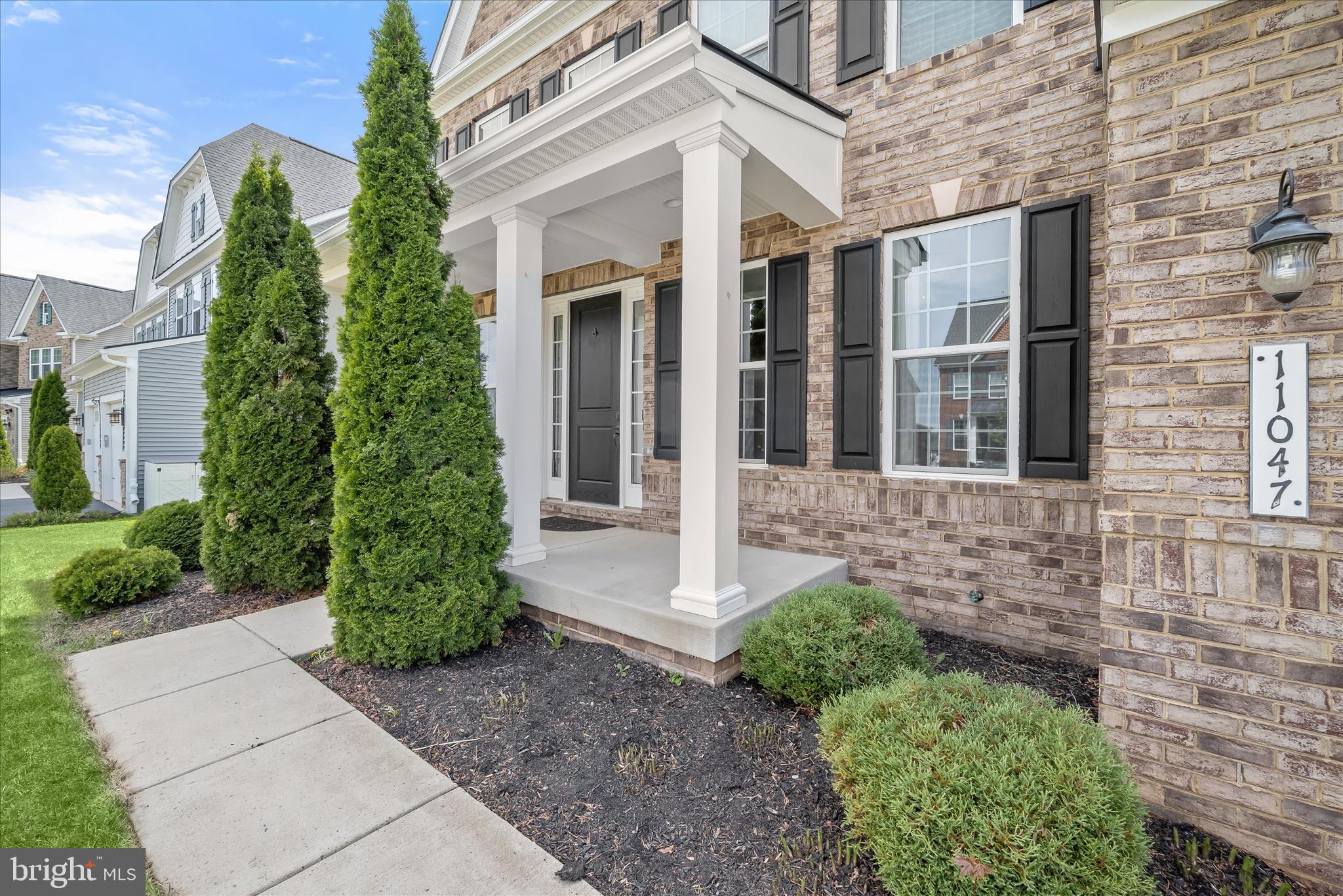 11047 Martha Way Fulton, MD 20759 - Photo 4 of 80 a front view of a house with garden