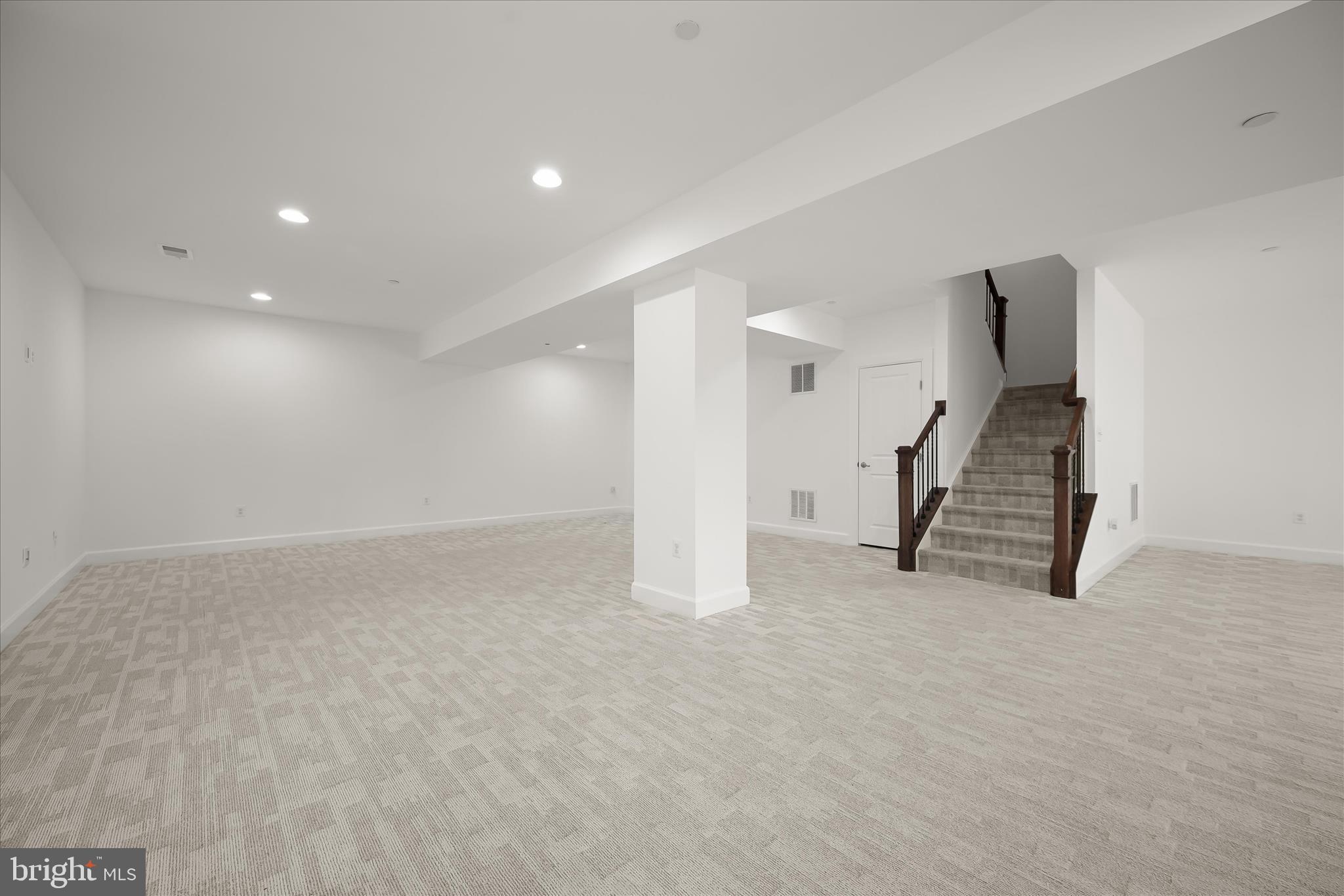 11047 Martha Way Fulton, MD 20759 - Photo 50 of 80 a view of an empty room with wooden floor