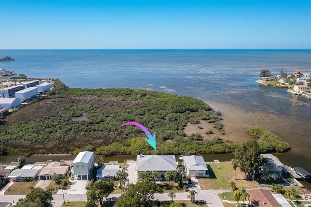 a large room with pool table and outdoor view