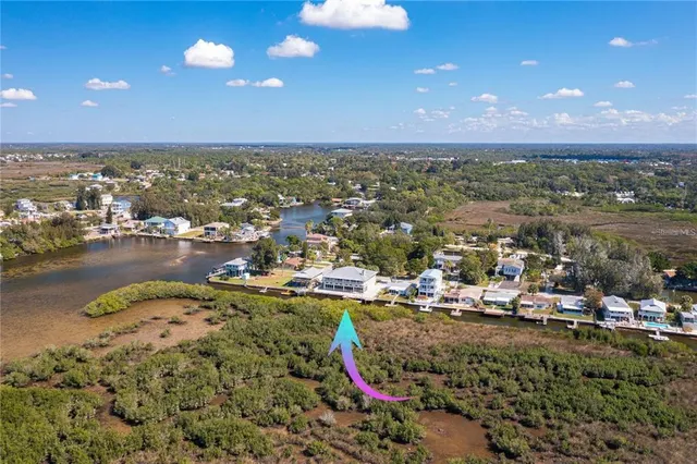 a living room with furniture a chandelier and a pool table
