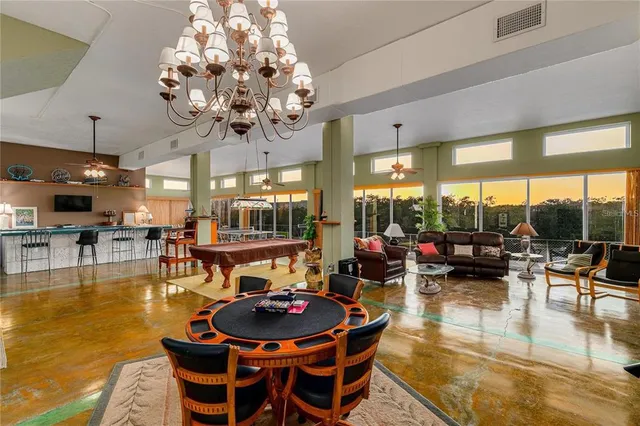 a utility room with cabinets washer and dryer
