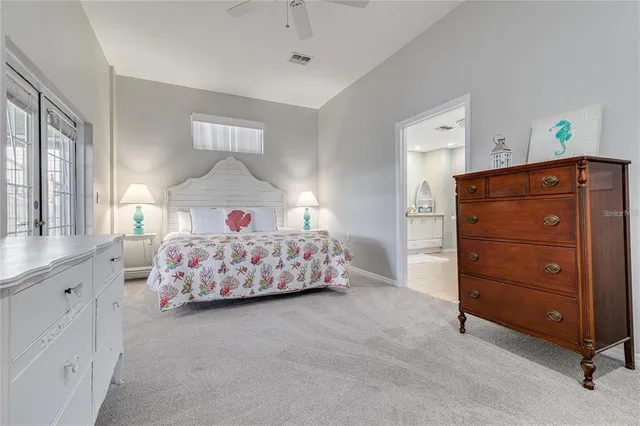 a kitchen with center island table and chairs