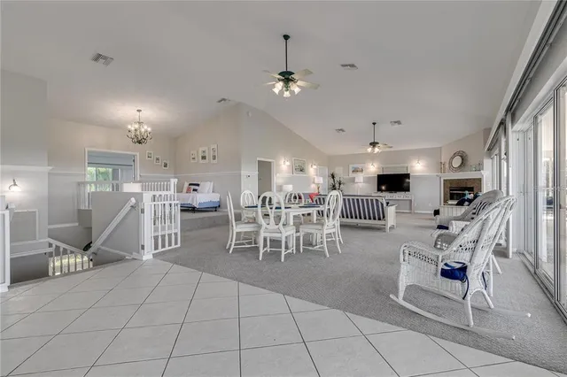 a view of living room filled with furniture and wooden floor