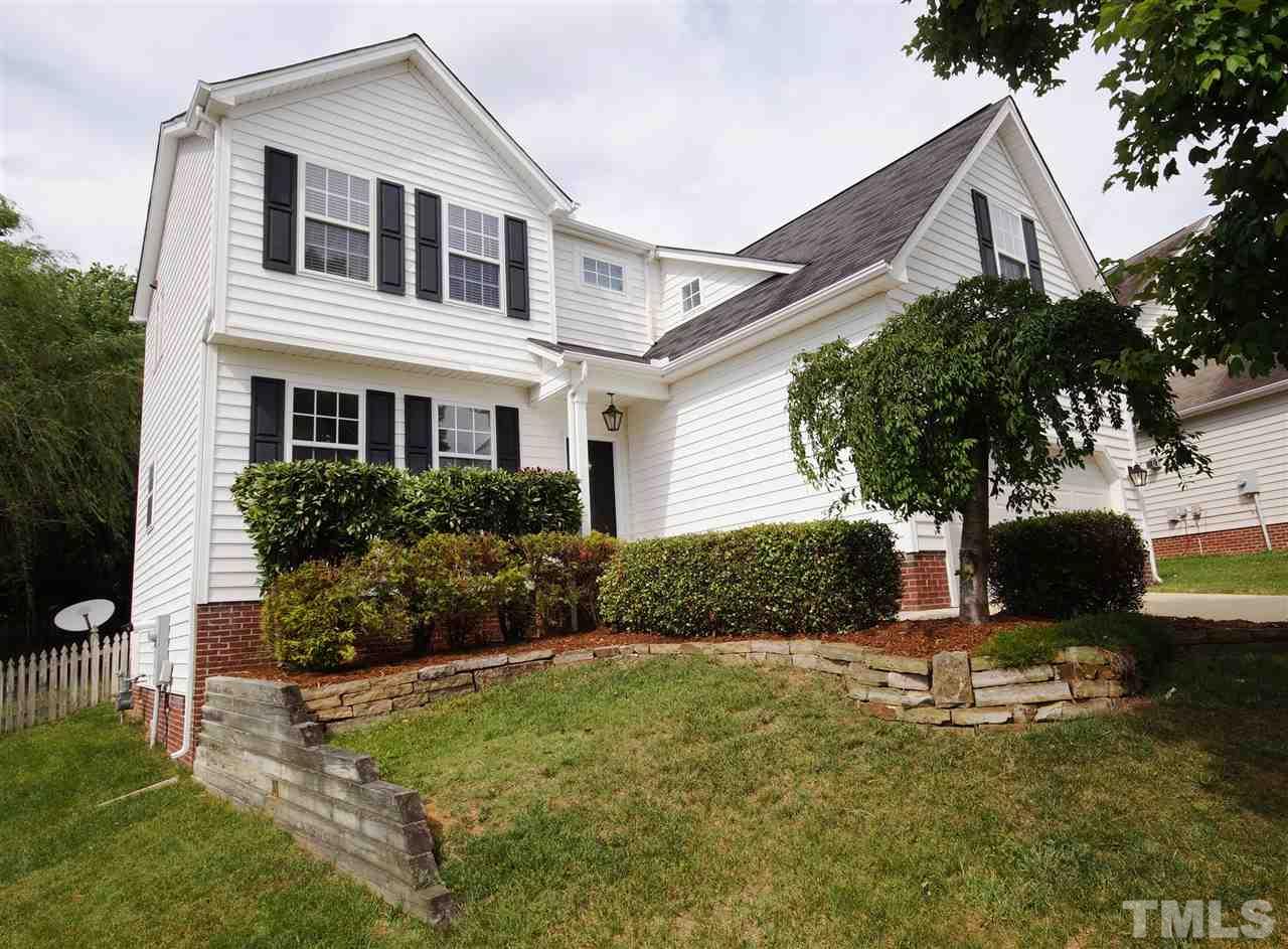 8512 Metronome Lane Raleigh, NC 27613 - Photo 1 of 4 a front view of a house with a yard