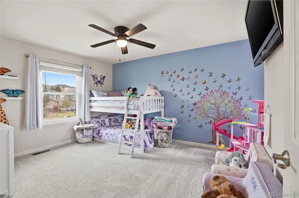 a spacious bathroom with double sink a mirror and a shower