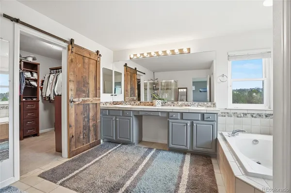 a bathroom with a shower and a sink