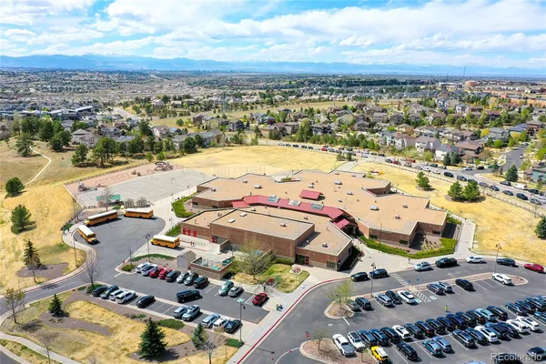 a spacious bedroom with a bed and a window