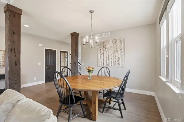 a view of a dining room with furniture window and wooden floor