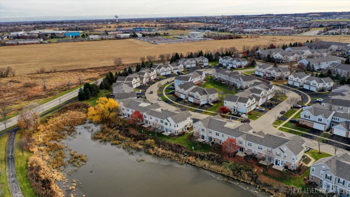 557 Springbrook Trail North Oswego, IL 60543 - Photo 19 of 25 an aerial view of a house with a lake view