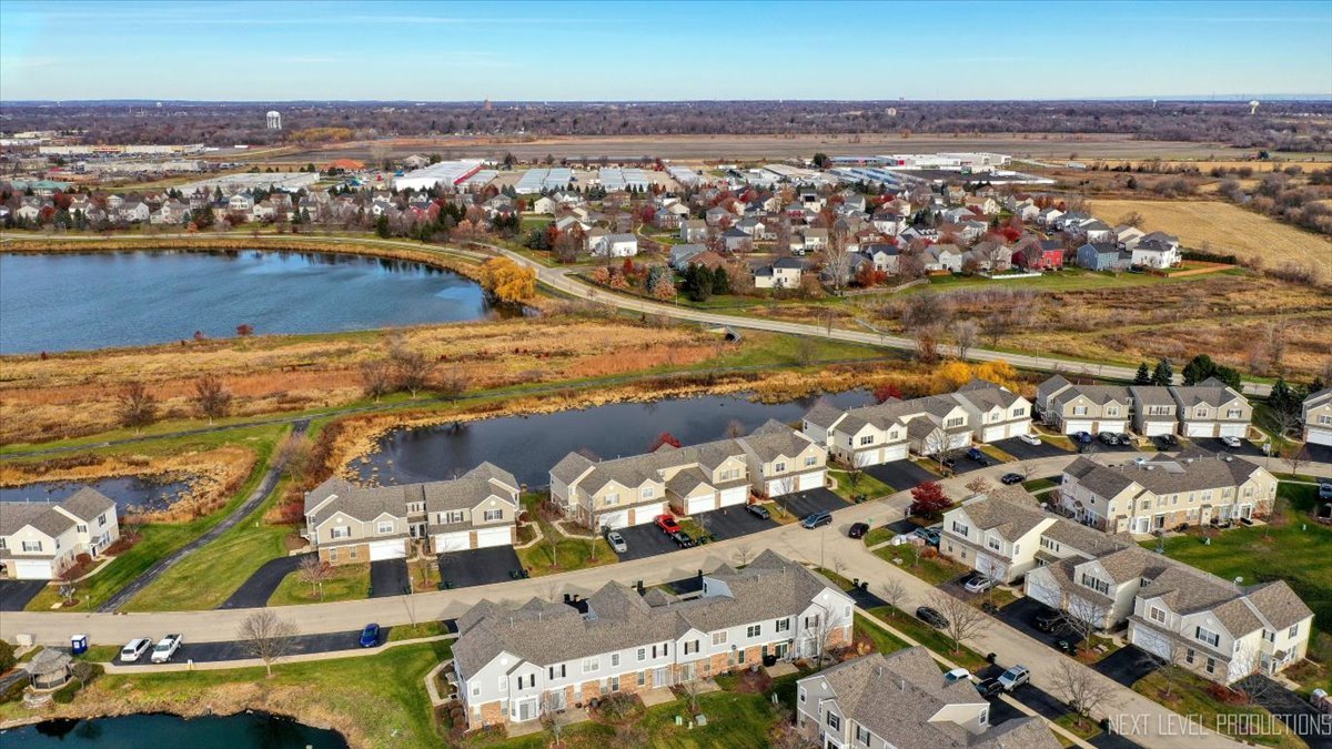 557 Springbrook Trail North Oswego, IL 60543 - Photo 22 of 25 an aerial view of residential houses with outdoor space