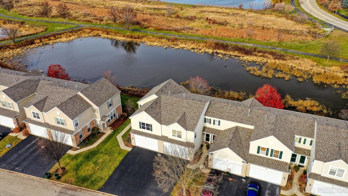 557 Springbrook Trail North Oswego, IL 60543 - Photo 23 of 25 an aerial view of houses with outdoor space