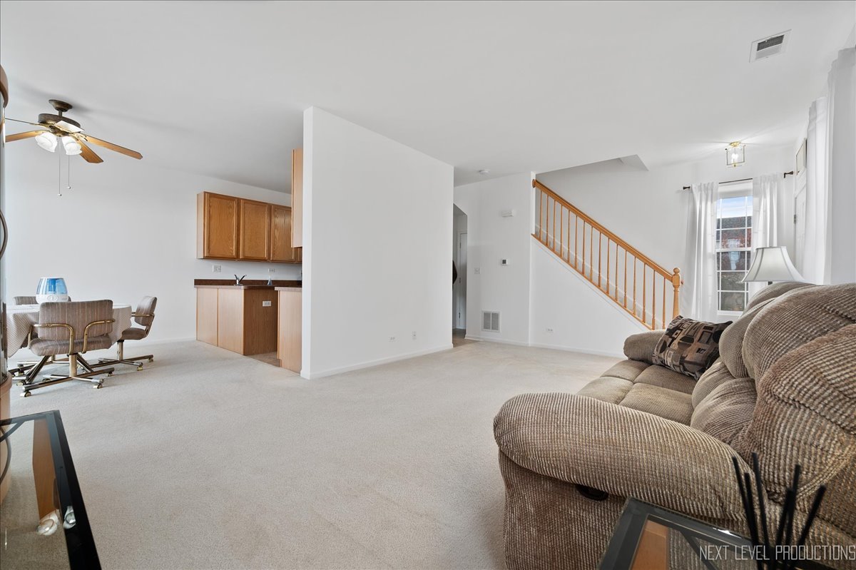557 Springbrook Trail North Oswego, IL 60543 - Photo 4 of 25 a living room with furniture