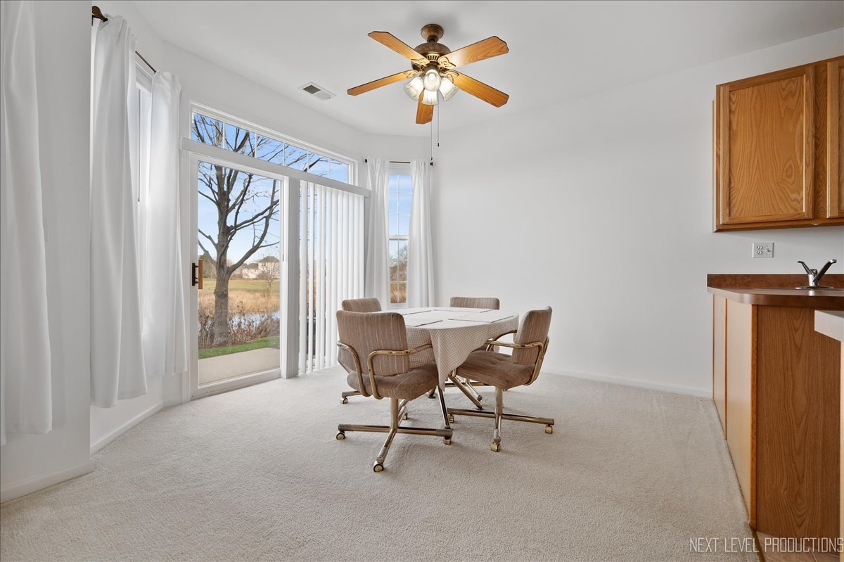 557 Springbrook Trail North Oswego, IL 60543 - Photo 5 of 25 a dining room with furniture and window