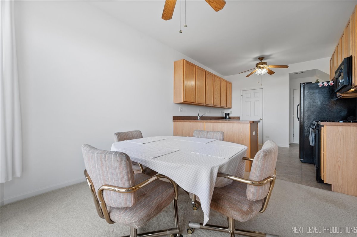 557 Springbrook Trail North Oswego, IL 60543 - Photo 6 of 25 a view of a dining room with furniture