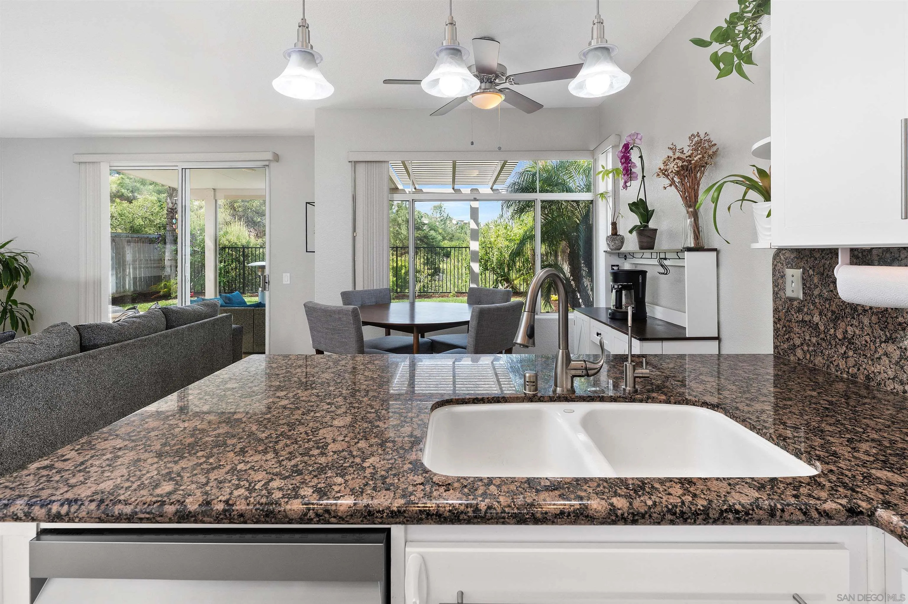 1571 Corte Daniel Oceanside, CA 92056 - Photo 15 of 44 a bathroom with a granite countertop sink and a large mirror