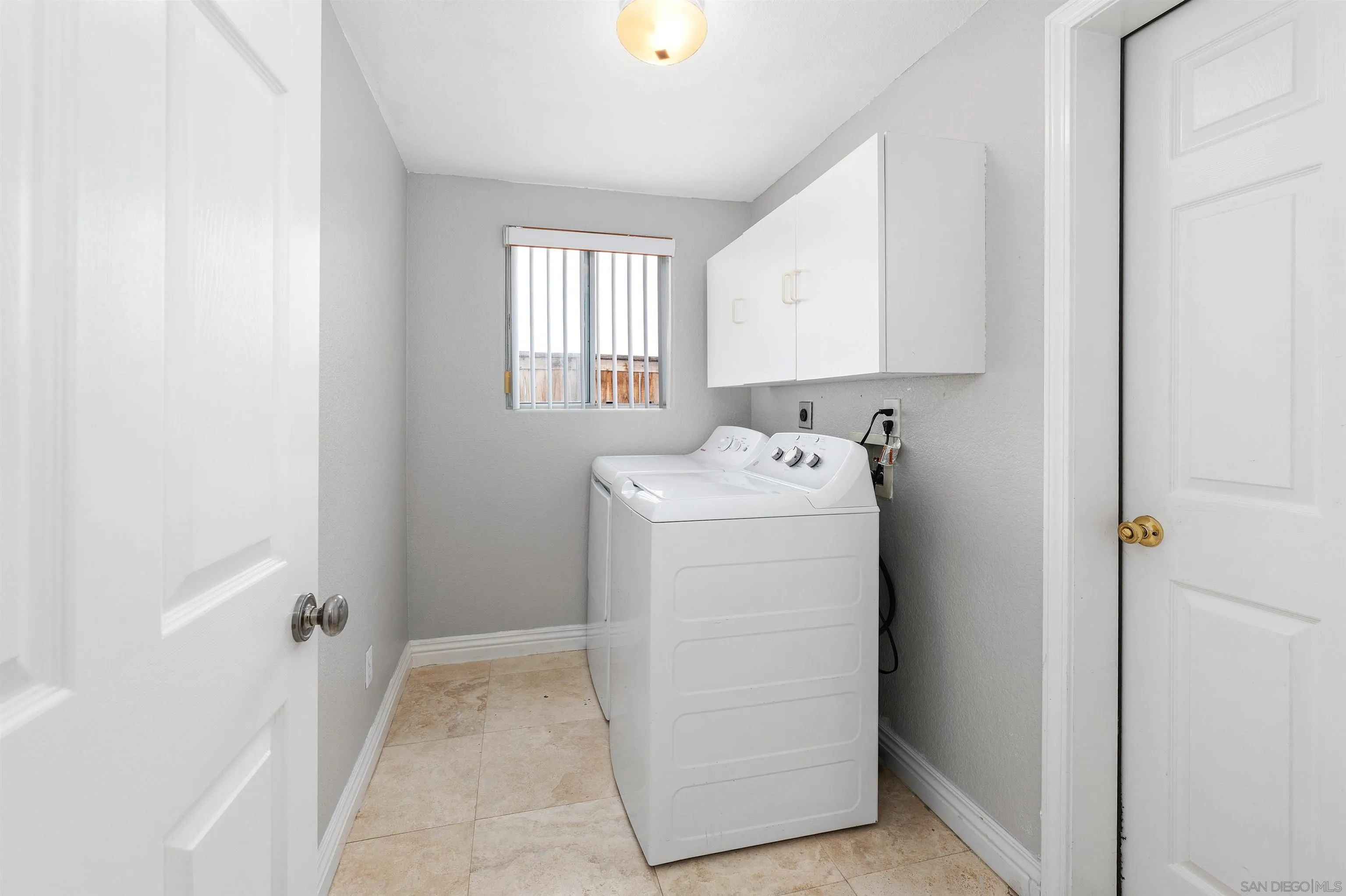 1571 Corte Daniel Oceanside, CA 92056 - Photo 22 of 44 a utility room with dryer and washer