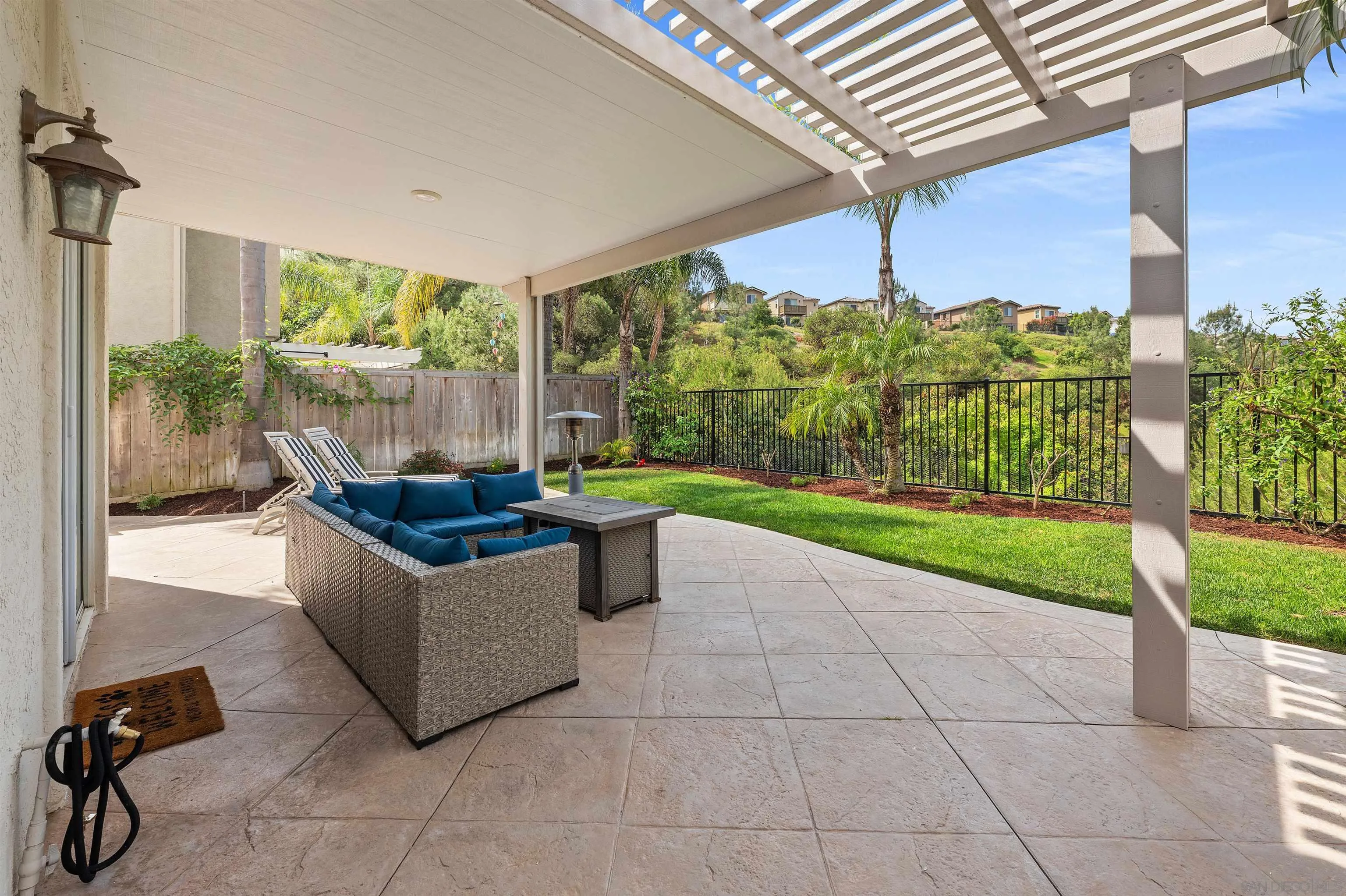 1571 Corte Daniel Oceanside, CA 92056 - Photo 23 of 44 a view of a patio with couches and a table and chairs