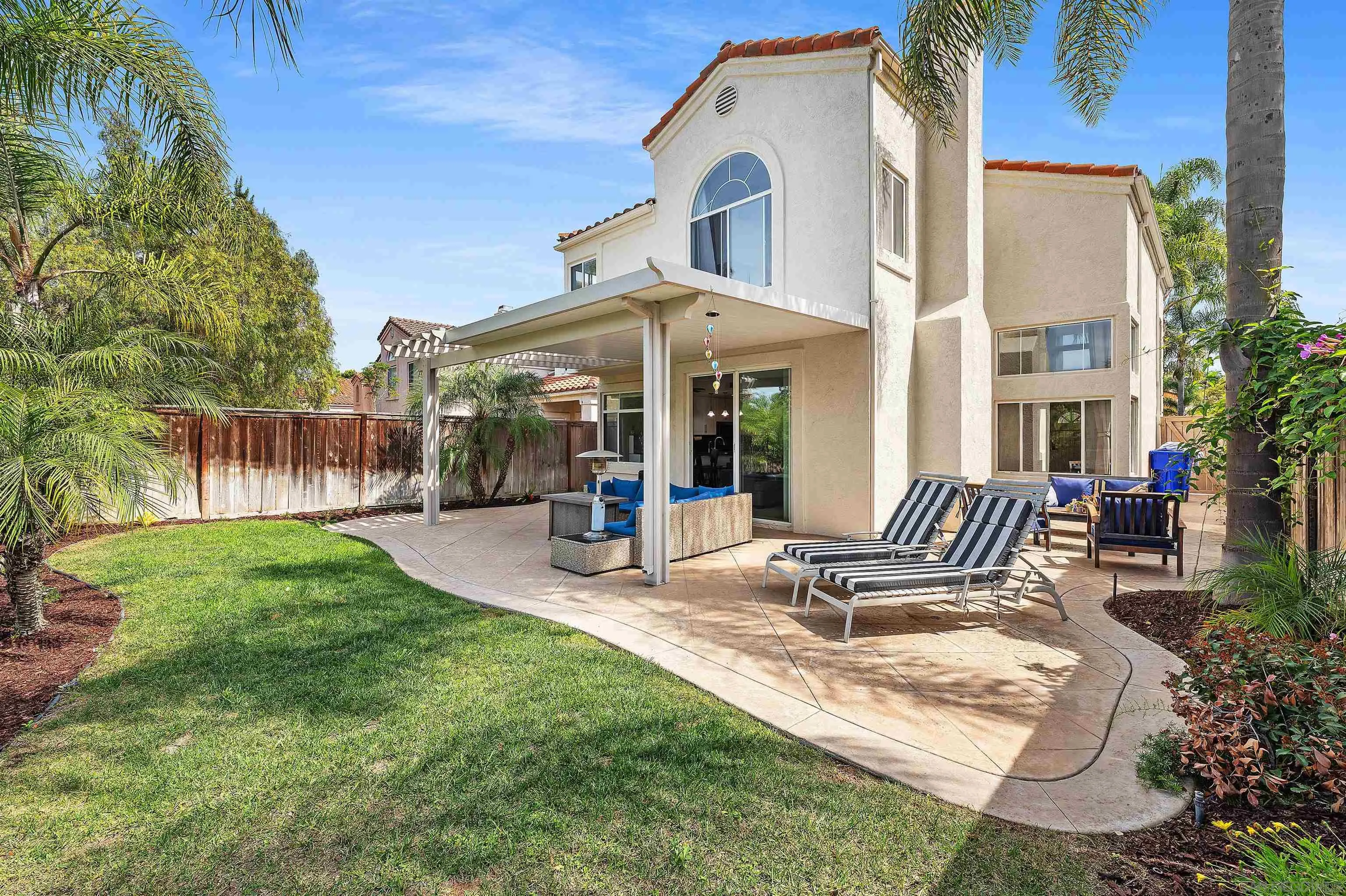 1571 Corte Daniel Oceanside, CA 92056 - Photo 26 of 44 a view of a house with backyard porch and sitting area