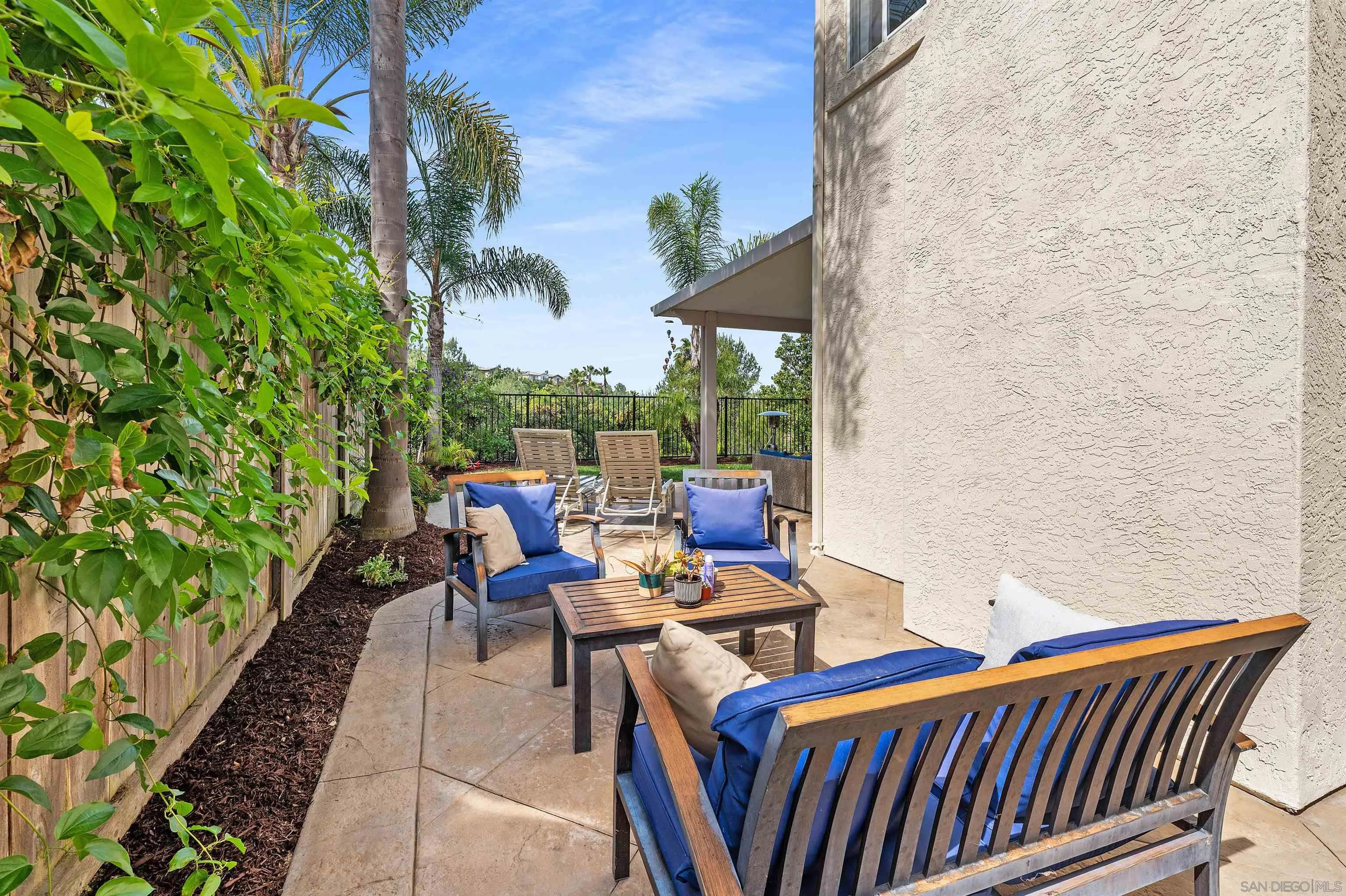 1571 Corte Daniel Oceanside, CA 92056 - Photo 27 of 44 a view of a patio with chairs and potted plants