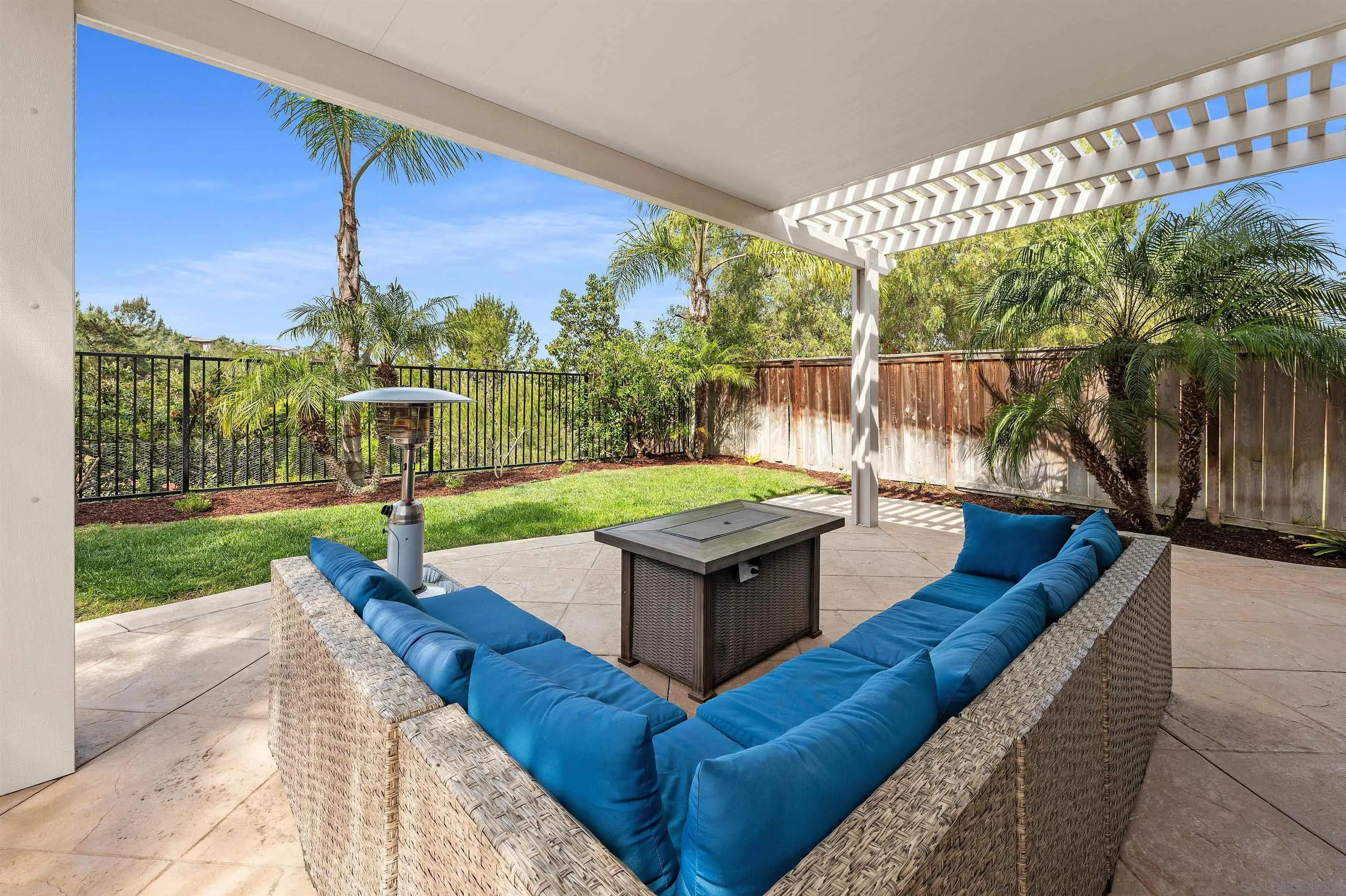1571 Corte Daniel Oceanside, CA 92056 - Photo 28 of 44 a swimming pool with a yard and outdoor seating