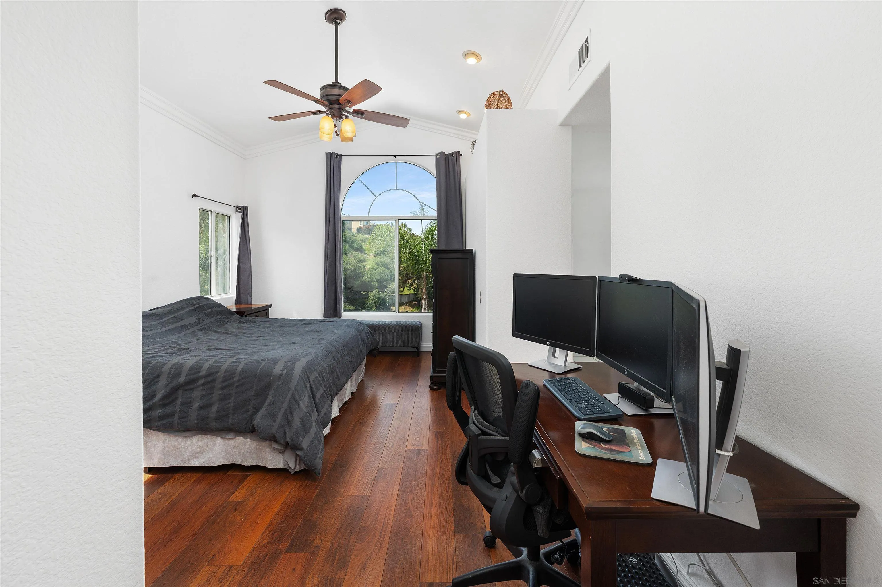 1571 Corte Daniel Oceanside, CA 92056 - Photo 32 of 44 a bedroom with a bed window and a desk
