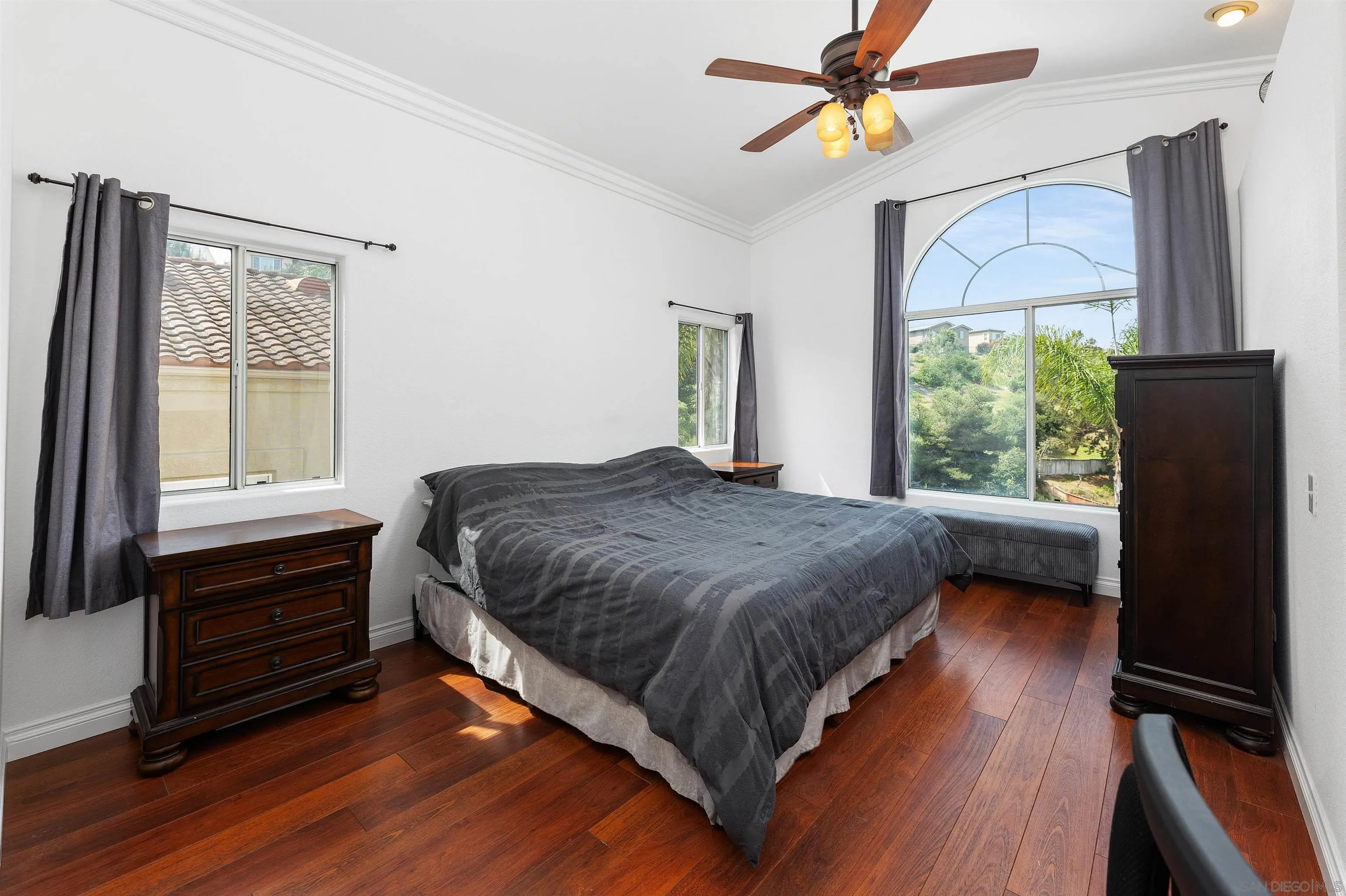 1571 Corte Daniel Oceanside, CA 92056 - Photo 33 of 44 a bedroom with a bed dresser and a window