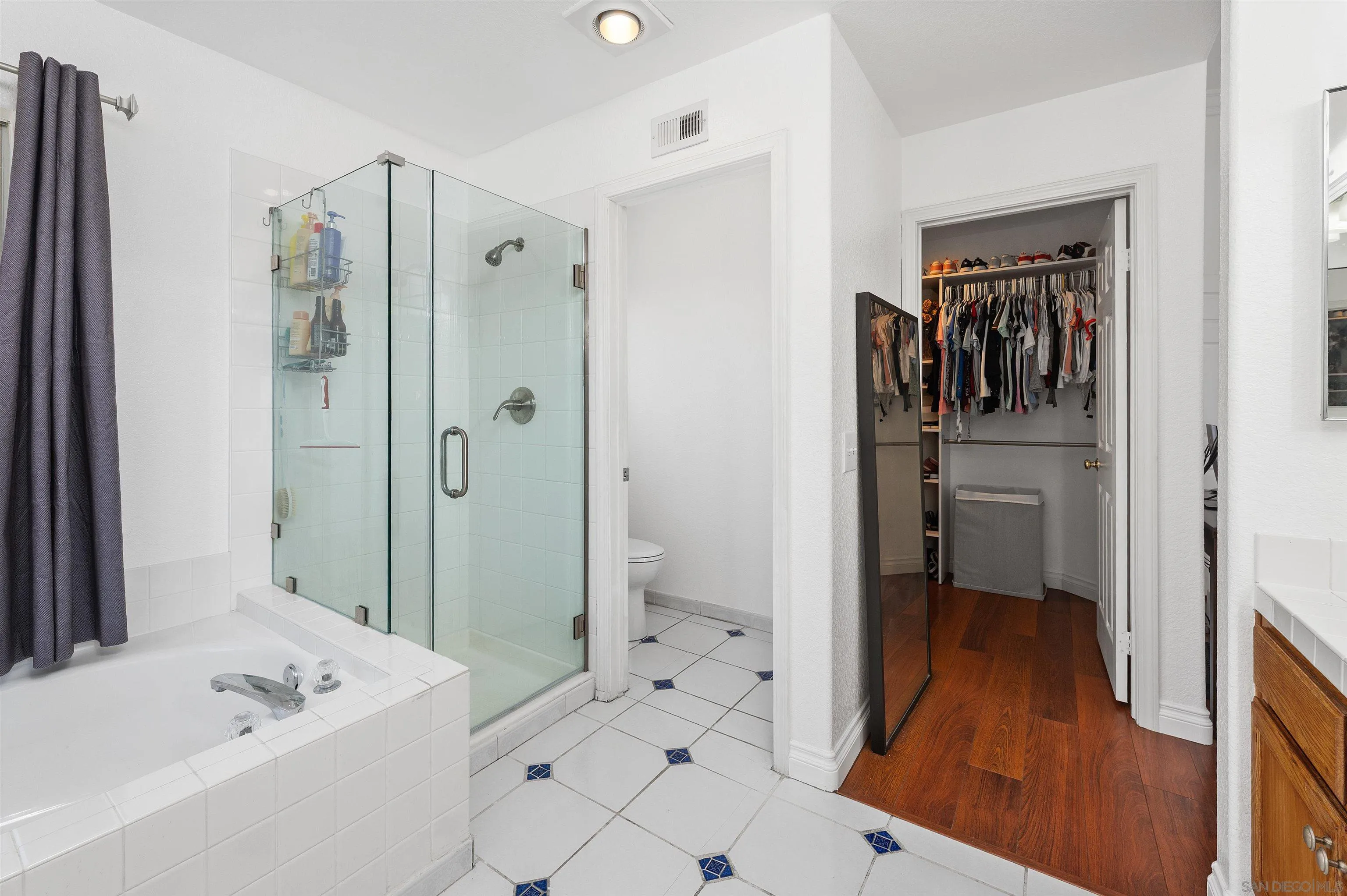 1571 Corte Daniel Oceanside, CA 92056 - Photo 37 of 44 a bathroom with a sink a toilet and shower
