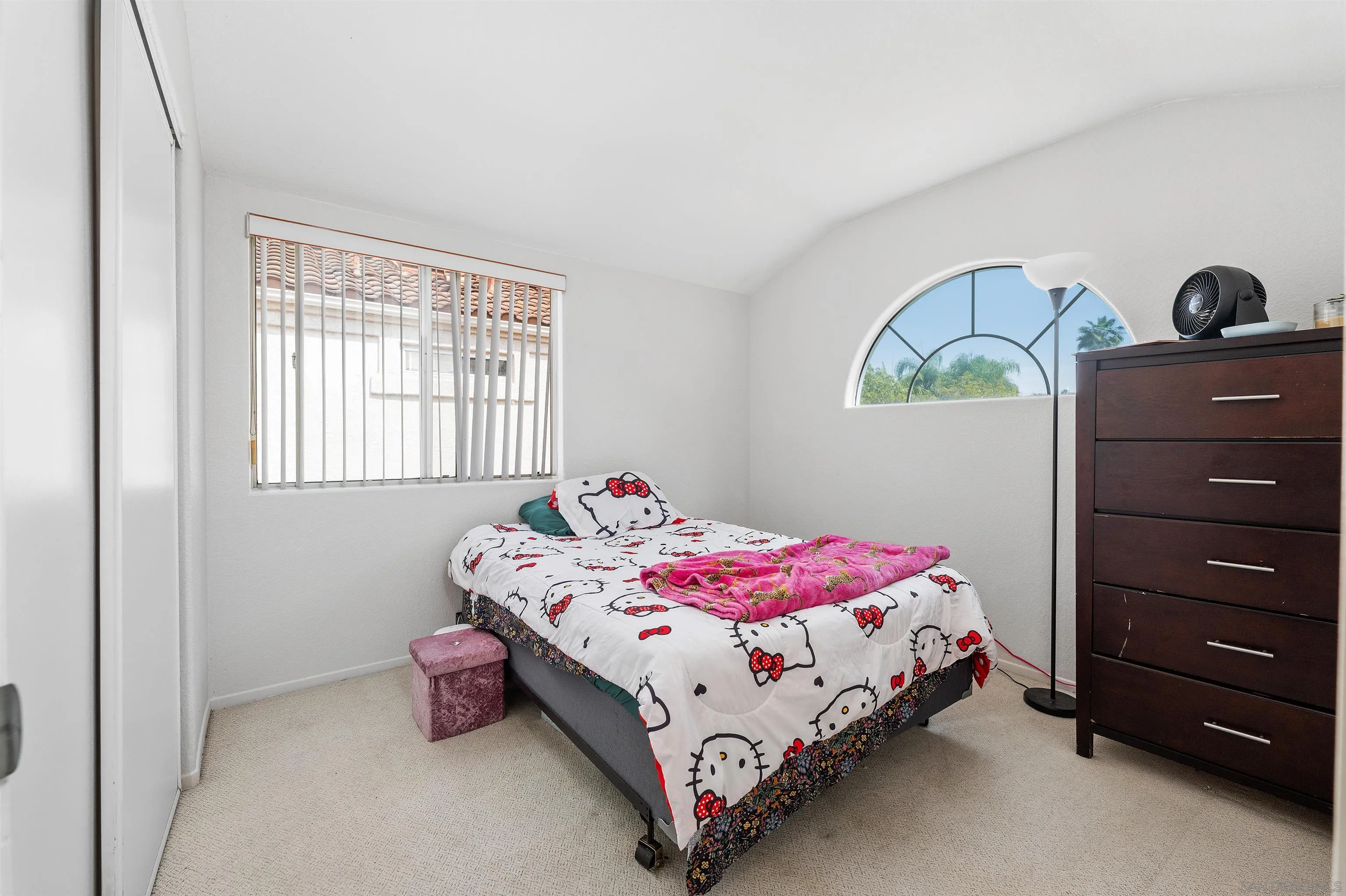 1571 Corte Daniel Oceanside, CA 92056 - Photo 41 of 44 a bedroom with a bed and a window