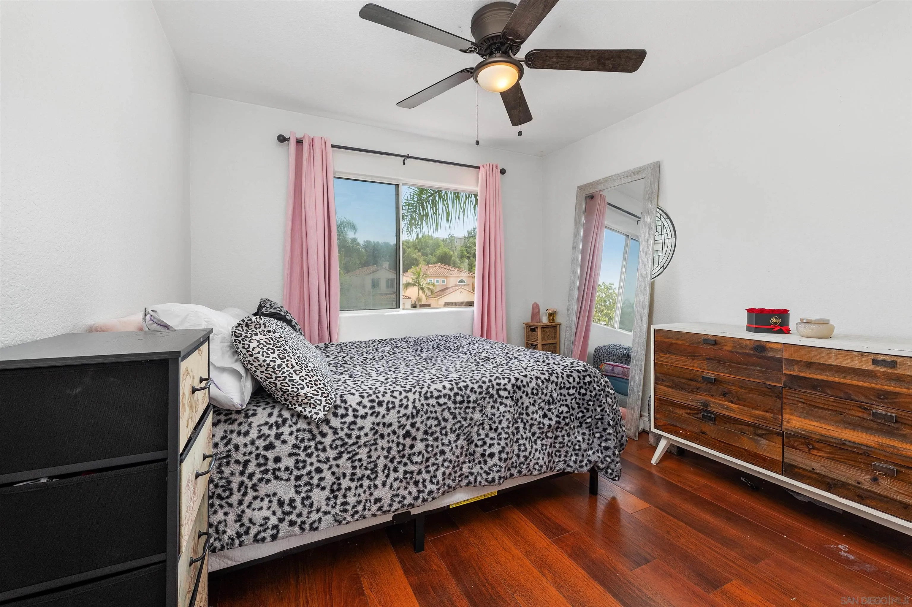 1571 Corte Daniel Oceanside, CA 92056 - Photo 42 of 44 a bed room with a bed and a window