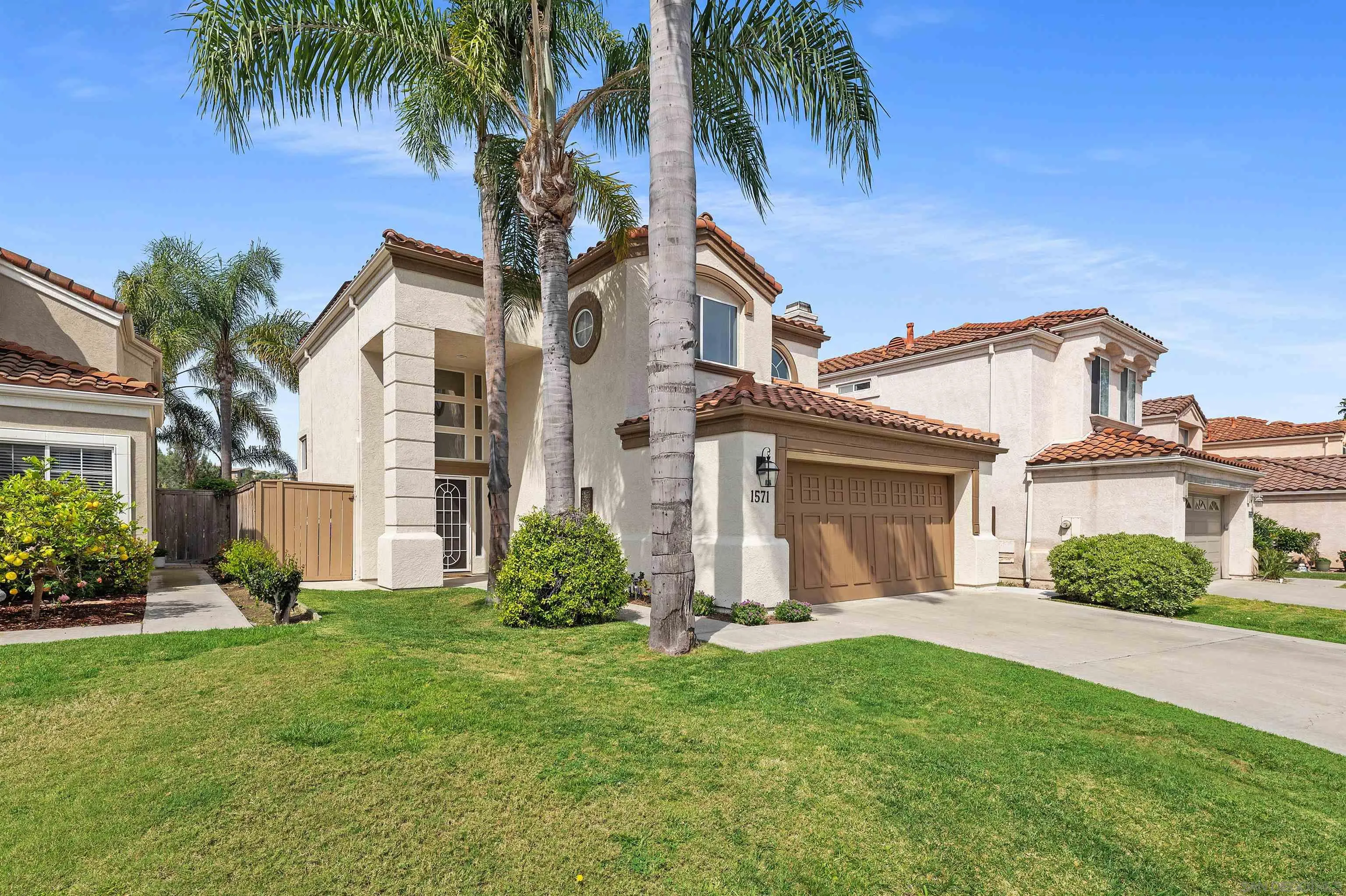 1571 Corte Daniel Oceanside, CA 92056 - Photo 5 of 44 front view of a house with a yard