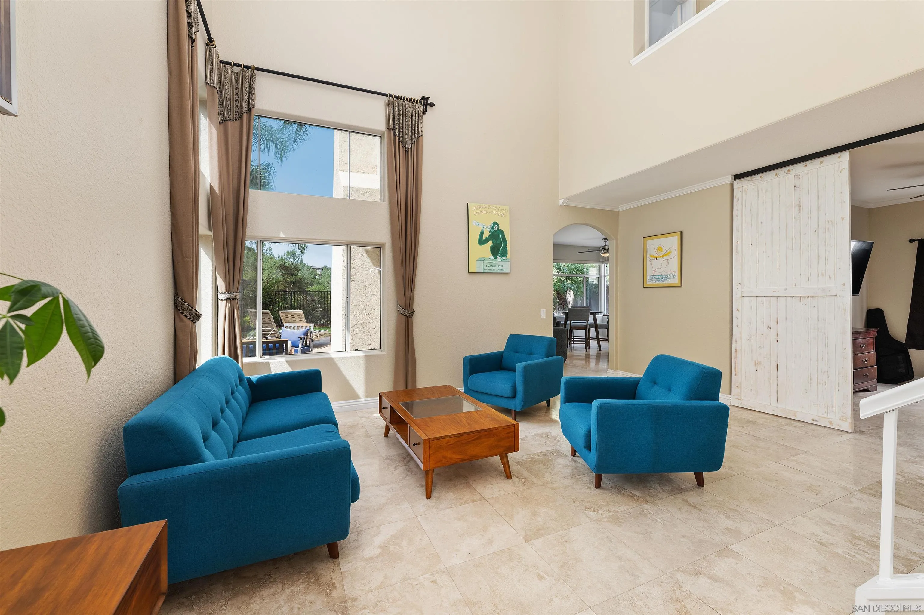 1571 Corte Daniel Oceanside, CA 92056 - Photo 8 of 44 a living room with furniture and a large window
