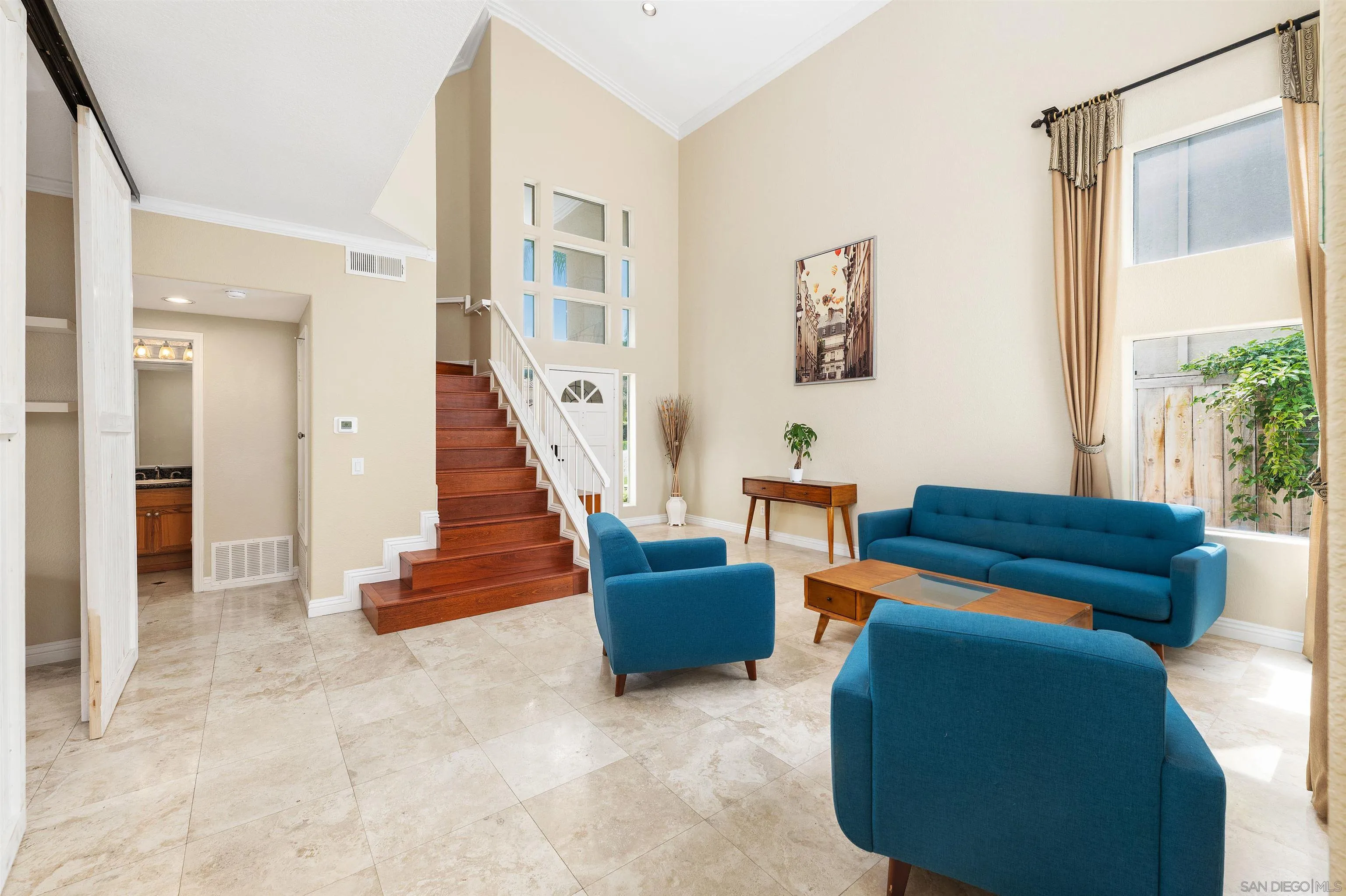 1571 Corte Daniel Oceanside, CA 92056 - Photo 10 of 44 a living room with furniture and a gate