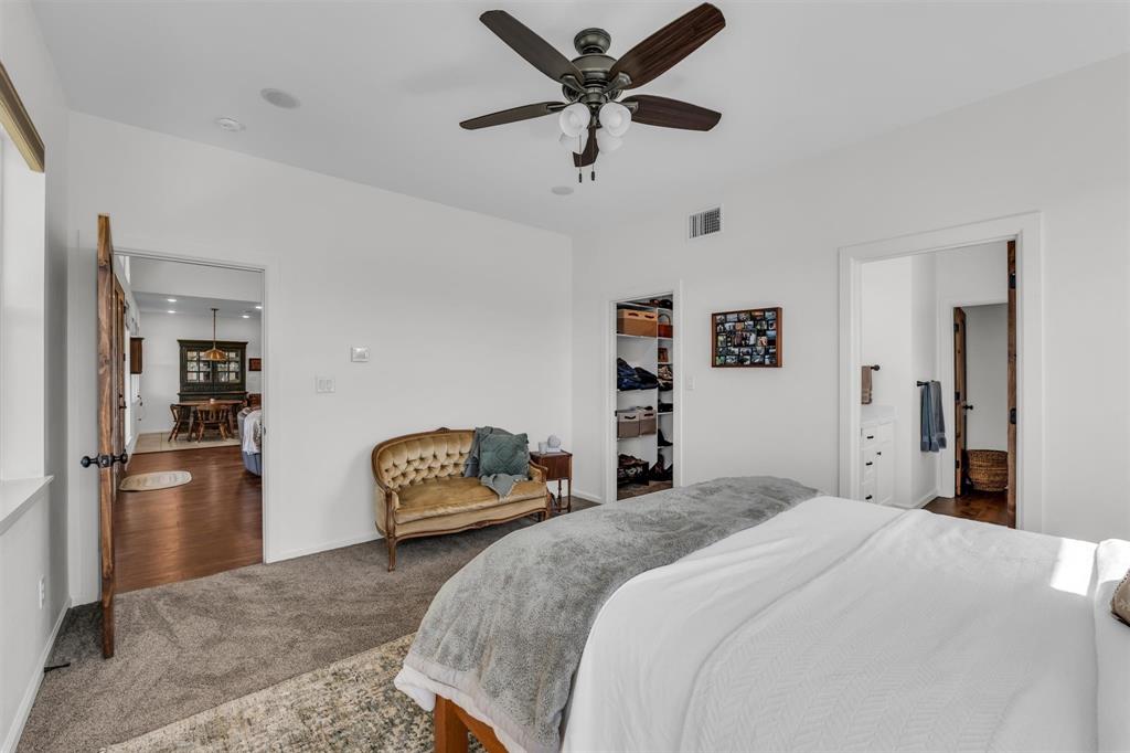 211 Knust Circle Gholson, TX 76705 - Photo 14 of 34 a bedroom with a bed and a chandelier