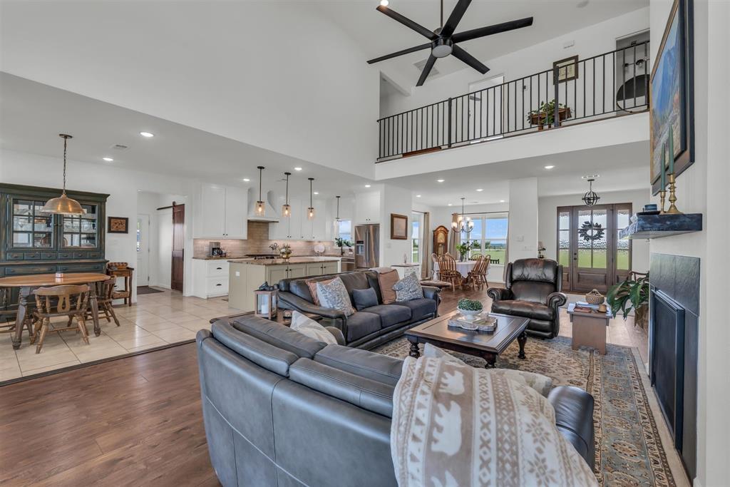 211 Knust Circle Gholson, TX 76705 - Photo 19 of 34 a living room with furniture and a dining table with wooden floor