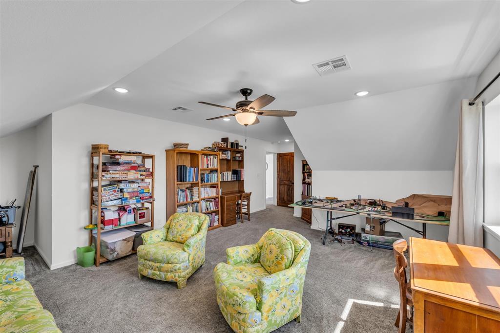 211 Knust Circle Gholson, TX 76705 - Photo 20 of 34 a living room with furniture gym equipment and a chandelier